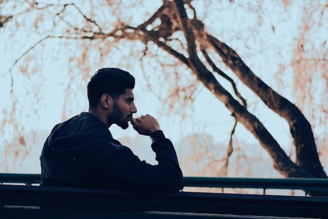 man sitting on a bench thinking