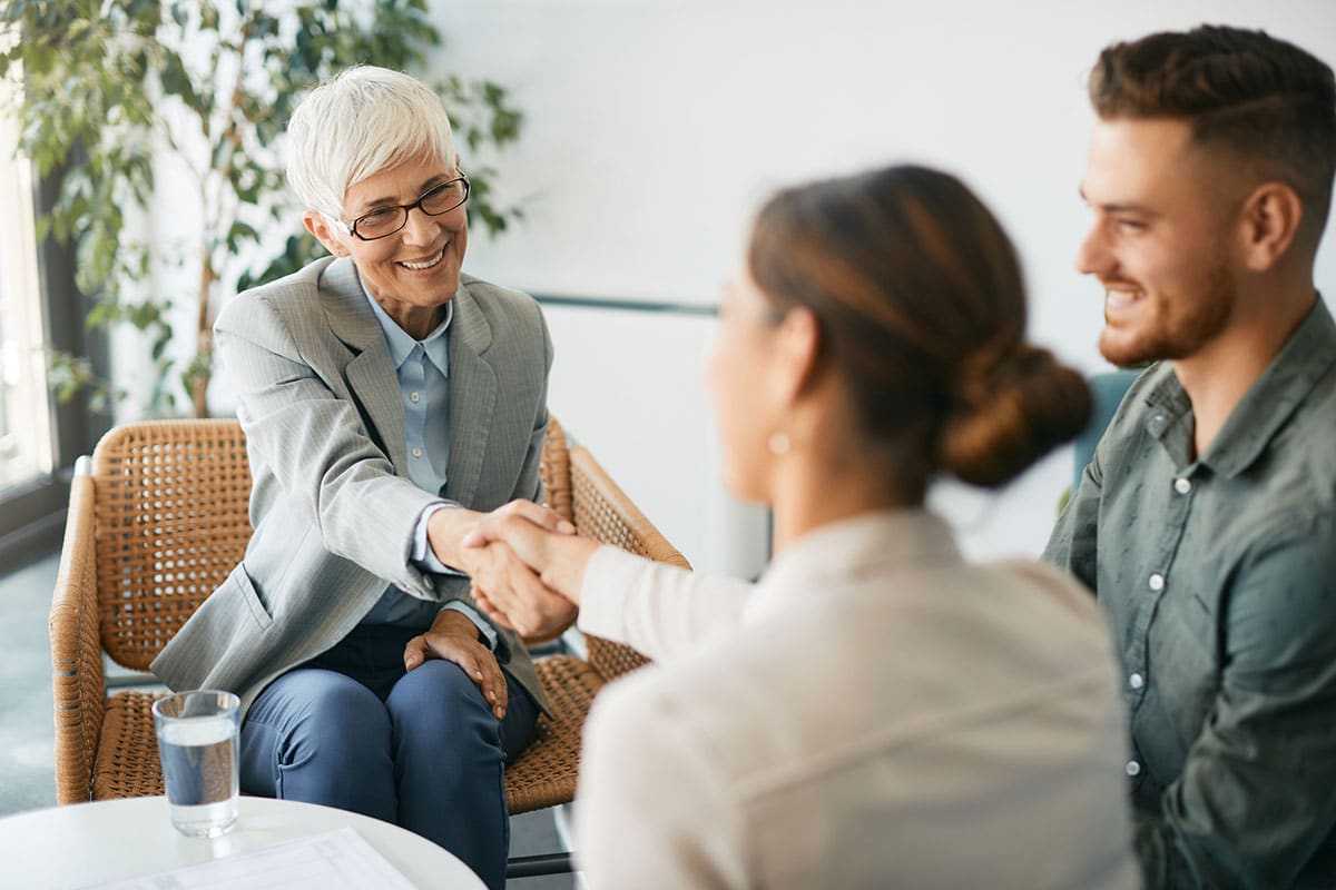 Counselor shaking Woman's Hand