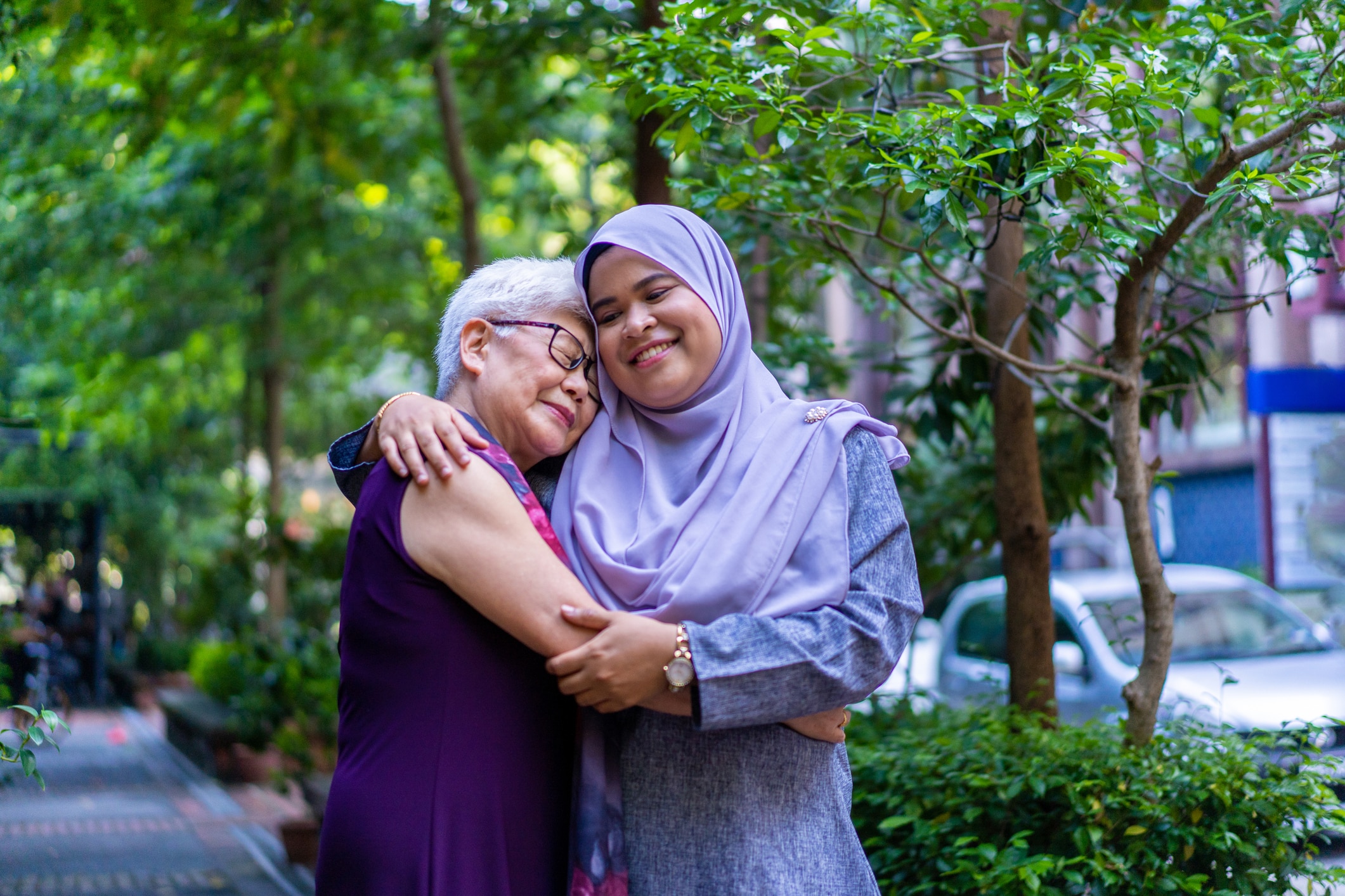 A hug says it all, Asian multi-racial togetherness and strength
