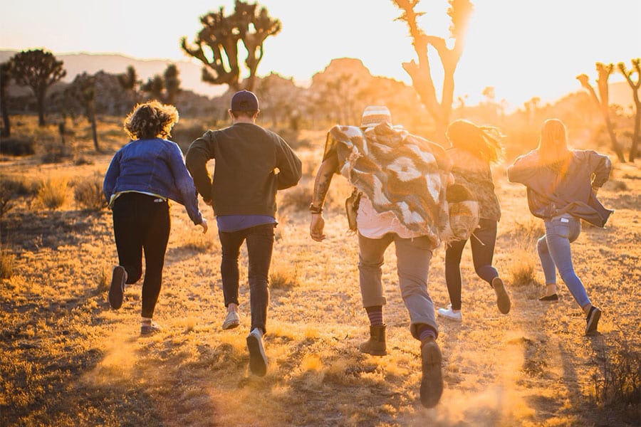 young-adults-running Young Adults Running in Desert